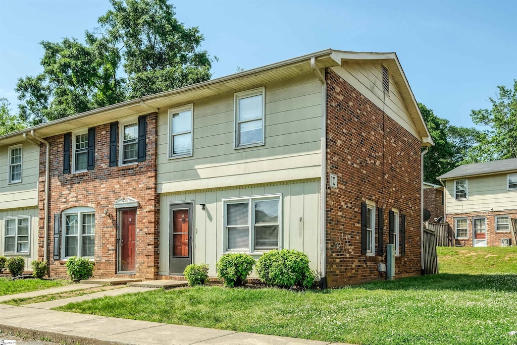 6526 White Horse Rd Apt 10D, Greenville, SC 29611 - view of front of home featuring a front yard and brick siding