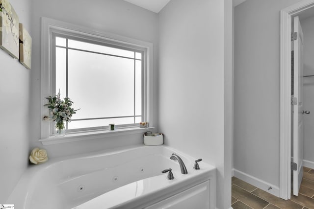 301 Highland Springs Loop, Inman, SC 29349 - bathroom with a jetted tub and baseboards