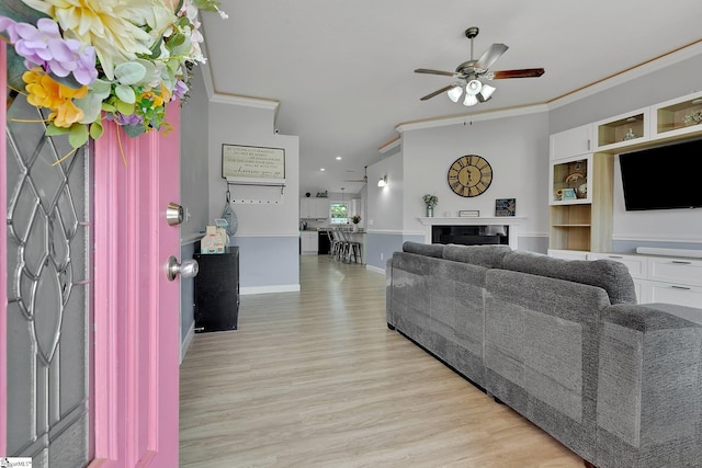 301 Highland Springs Loop, Inman, SC 29349 - living area featuring ceiling fan, ornamental molding, light wood-style floors, a fireplace, and baseboards