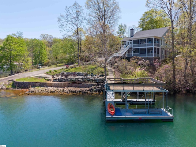 dock area with stairs and a water view