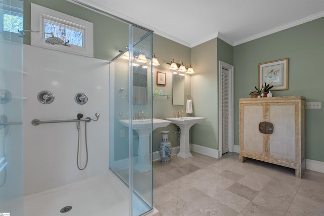 bathroom with crown molding, a shower stall, and baseboards