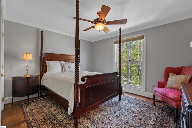 bedroom with crown molding, wood finished floors, baseboards, and a ceiling fan