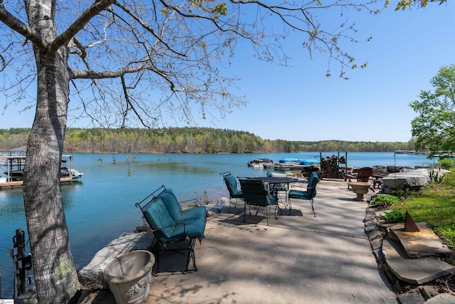 dock featuring a water view and a view of trees