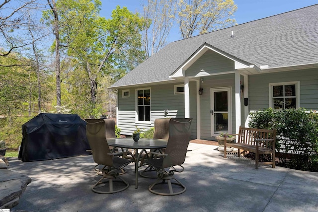 view of patio featuring a grill and outdoor dining area