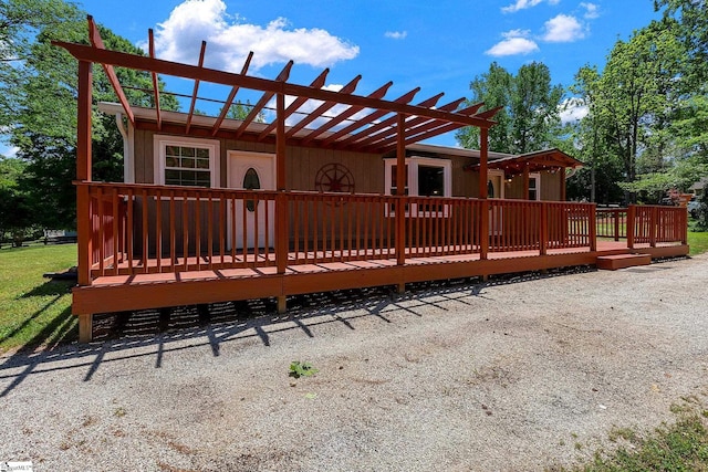 wooden deck featuring a pergola
