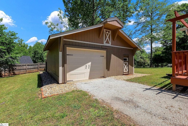 detached garage with gravel driveway
