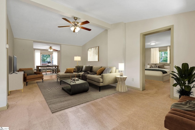 living area with light colored carpet, a ceiling fan, and healthy amount of natural light