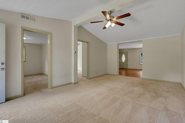 carpeted empty room with a ceiling fan and baseboards