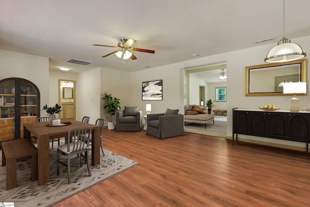 dining room with ceiling fan and wood finished floors