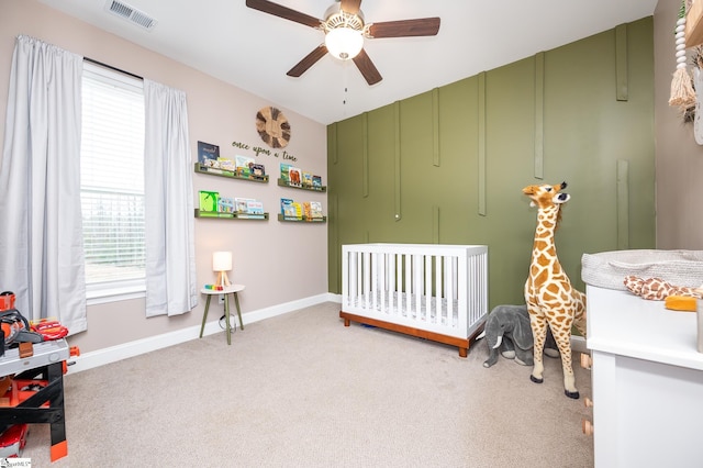407 Saylor Way, Taylors, SC 29687 - carpeted bedroom with a nursery area, baseboards, and ceiling fan