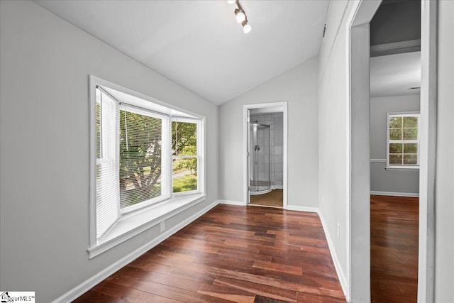 215 Rebecca St, Greenville, SC 29607 - unfurnished room featuring hardwood / wood-style flooring, vaulted ceiling, baseboards, and track lighting