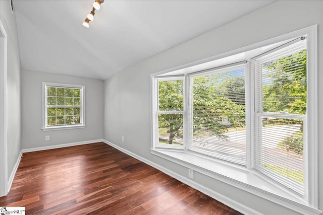 215 Rebecca St, Greenville, SC 29607 - empty room with baseboards, dark wood-type flooring, and lofted ceiling