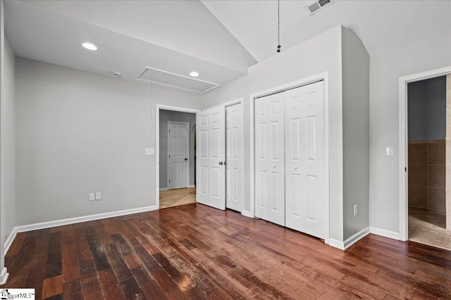 215 Rebecca St, Greenville, SC 29607 - unfurnished bedroom featuring attic access, wood finished floors, baseboards, recessed lighting, and multiple closets