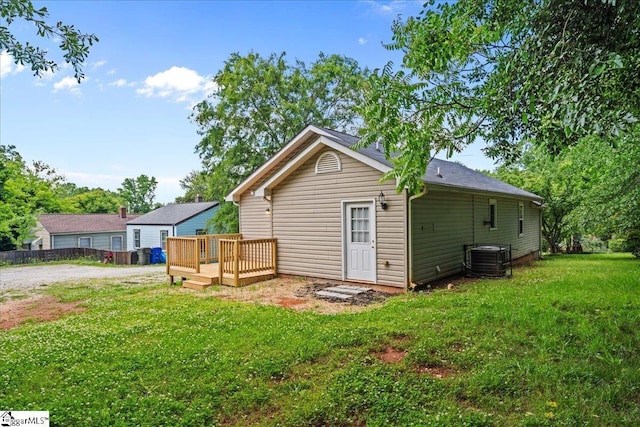 215 Rebecca St, Greenville, SC 29607 - rear view of house featuring cooling unit, a deck, and a lawn