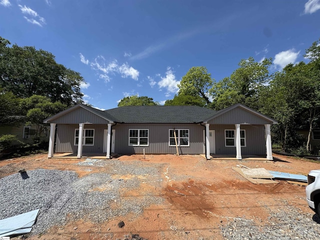 rear view of house with covered porch