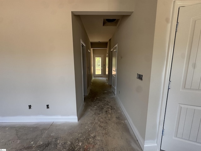 corridor featuring baseboards