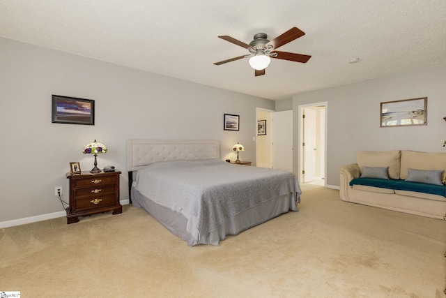 carpeted bedroom with baseboards and a ceiling fan