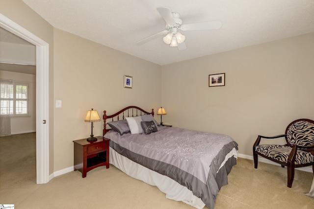 bedroom featuring carpet floors, baseboards, and ceiling fan