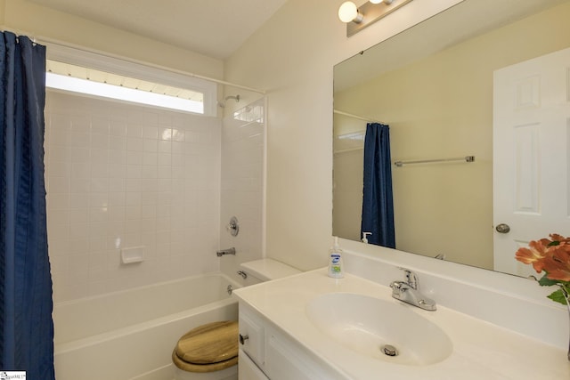 full bath featuring toilet, shower / bath combo, and vanity