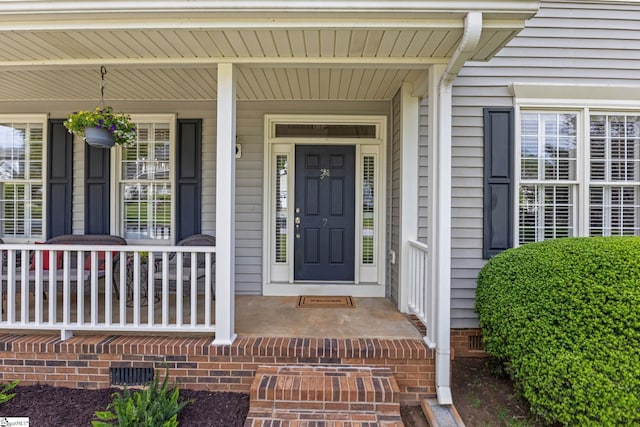 doorway to property featuring a porch