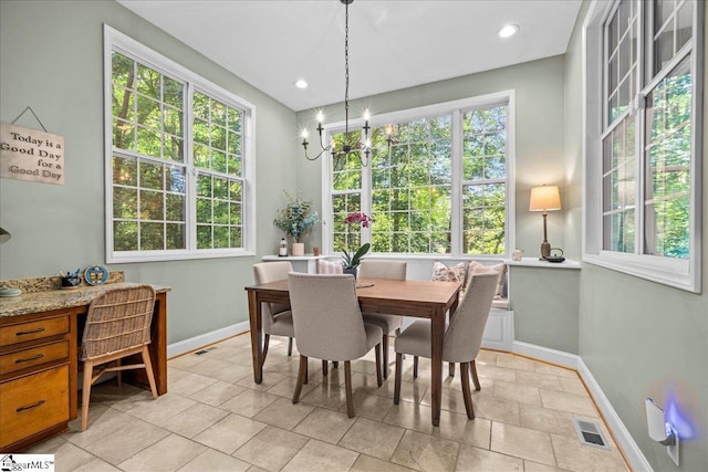 dining room with baseboards, a chandelier, a desk, and recessed lighting