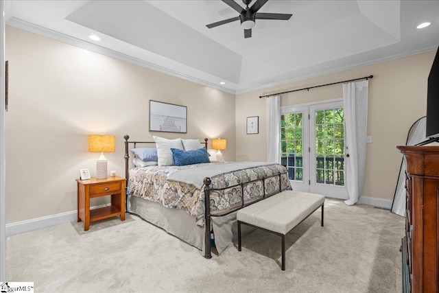 bedroom with a raised ceiling, light carpet, access to exterior, baseboards, and ornamental molding