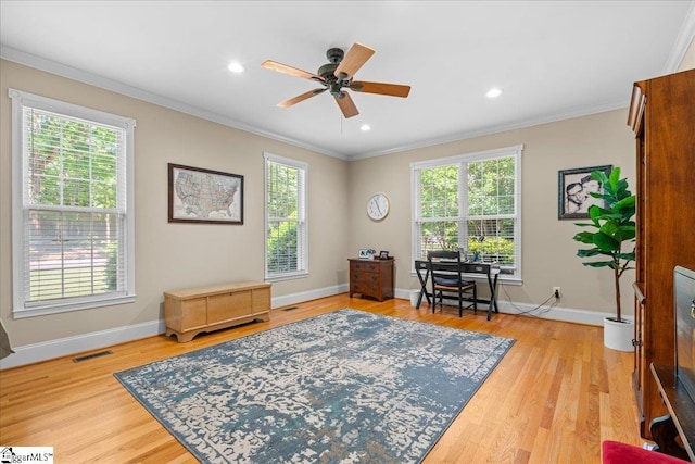 living area featuring ornamental molding, a ceiling fan, baseboards, light wood-style flooring, and recessed lighting