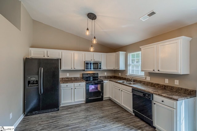 175 Falcon Ridge Dr, Boiling Springs, SC 29316 - kitchen with black appliances, a sink, dark countertops, vaulted ceiling, and white cabinets