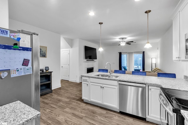 113 Forest Ridge Way, Greenville, SC 29617 - kitchen with stainless steel appliances, a sink, white cabinetry, and ceiling fan