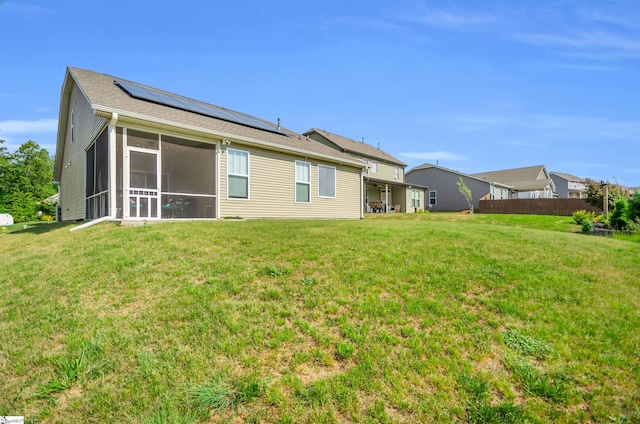 113 Forest Ridge Way, Greenville, SC 29617 - back of house with a sunroom, solar panels, and a yard