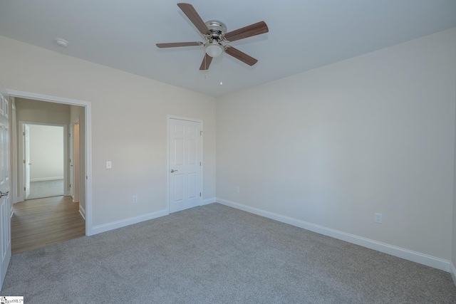 unfurnished bedroom with carpet flooring, baseboards, and ceiling fan