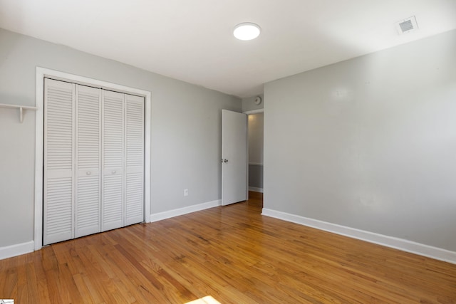 2028 Haven Ct, Boiling Springs, SC 29316 - unfurnished bedroom with baseboards, light wood finished floors, and a closet