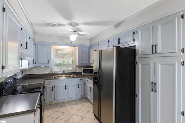 2028 Haven Ct, Boiling Springs, SC 29316 - kitchen featuring refrigerator with ice dispenser, a sink, black electric range, dark countertops, and stainless steel microwave