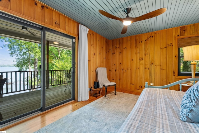295 Sugarhill Rd, Seneca, SC 29672 - bedroom featuring access to exterior, multiple windows, a water view, wood walls, and wood finished floors