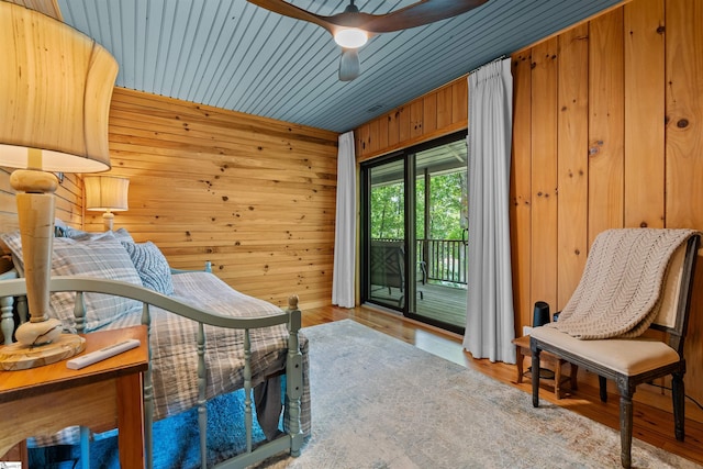 295 Sugarhill Rd, Seneca, SC 29672 - sitting room with wood walls, ceiling fan, and wood finished floors