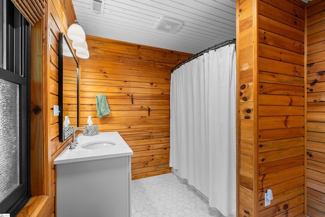 295 Sugarhill Rd, Seneca, SC 29672 - full bathroom with vanity, wood walls, and curtained shower