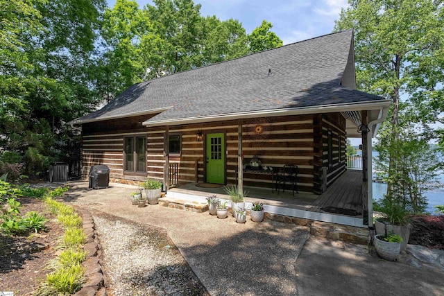 295 Sugarhill Rd, Seneca, SC 29672 - rear view of house featuring a shingled roof, a deck, and a patio