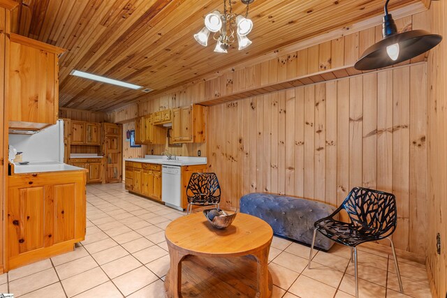 295 Sugarhill Rd, Seneca, SC 29672 - kitchen with white dishwasher, light countertops, light tile patterned floors, wood walls, and wooden ceiling