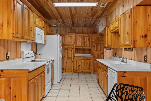 295 Sugarhill Rd, Seneca, SC 29672 - kitchen featuring white appliances, a sink, light tile patterned flooring, light countertops, and brown cabinets