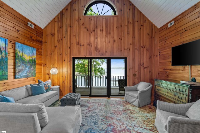 295 Sugarhill Rd, Seneca, SC 29672 - living room with wooden walls, high vaulted ceiling, and wood finished floors