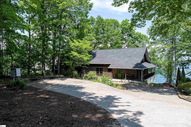 295 Sugarhill Rd, Seneca, SC 29672 - view of side of home featuring driveway, log exterior, and roof with shingles