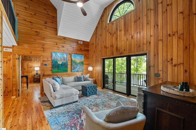 295 Sugarhill Rd, Seneca, SC 29672 - living area with high vaulted ceiling, wood walls, light wood-style floors, and ceiling fan