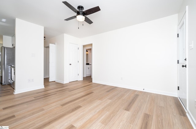 751 Running Creek Ln, Boiling Springs, SC 29316 - unfurnished bedroom with light wood-type flooring, baseboards, and freestanding refrigerator