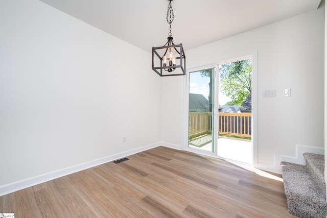 751 Running Creek Ln, Boiling Springs, SC 29316 - unfurnished dining area featuring light wood-style floors, a chandelier, baseboards, and stairs