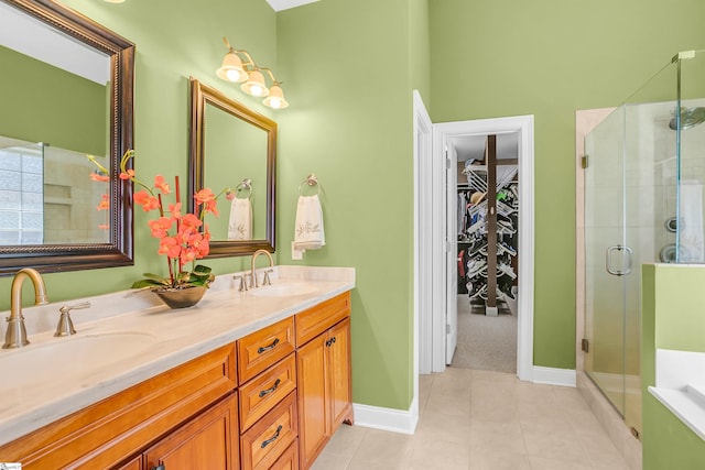 111 Tinsley Ct, Greenville, SC 29615 - bathroom with a stall shower, tile patterned floors, a spacious closet, double vanity, and baseboards