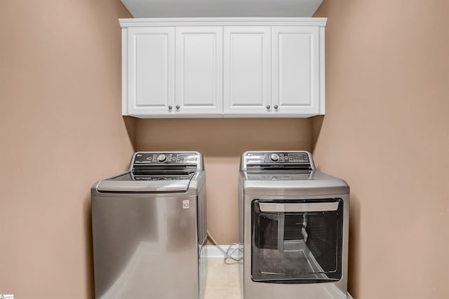 111 Tinsley Ct, Greenville, SC 29615 - laundry room with cabinet space, separate washer and dryer, and light tile patterned flooring