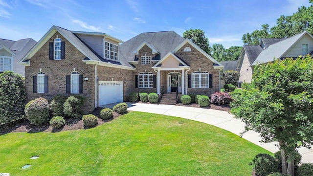 111 Tinsley Ct, Greenville, SC 29615 - craftsman house with driveway, a front lawn, brick siding, and a garage