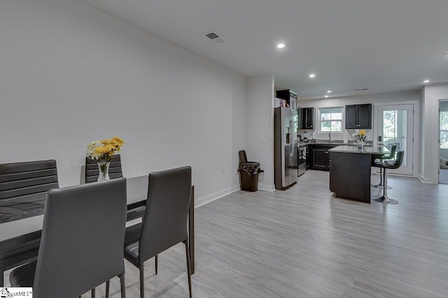 321 Aldworth Ln, Fountain Inn, SC 29644 - dining room featuring light wood-type flooring, recessed lighting, and baseboards