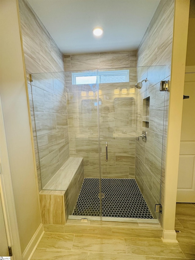 full bath with a stall shower, baseboards, and recessed lighting