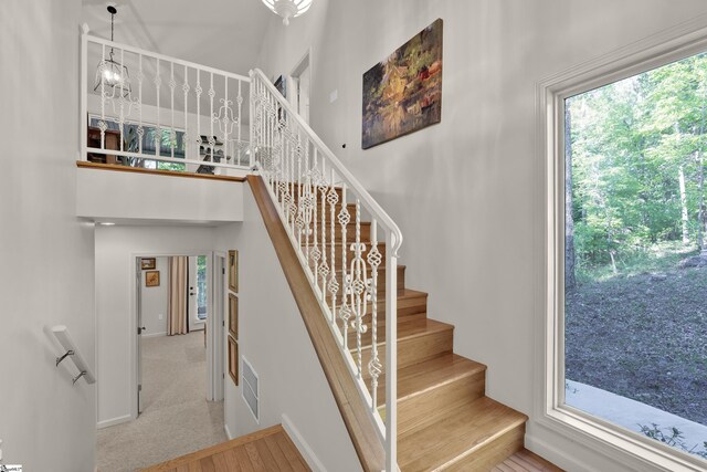451 Cedar Creek Rd, Sunset, SC 29685 - staircase featuring baseboards and a towering ceiling